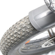 Close-up of a motorcycle tire with tread pattern on a white background