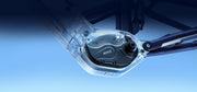 A close-up of a transparent protective casing over a black circular mechanical component with the brand name 'MYRCE' visible, attached to a dark metal frame against a blue gradient background.