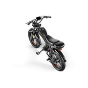 A black electric fat-tire bicycle with a step-through frame, digital handlebar display, and a single rear passenger seat, shown from a high-angle perspective on a solid white background.