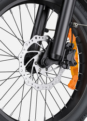 Close-up of a motorcycle wheel with disc brake system on a white background