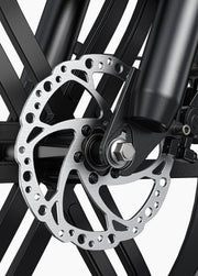 Close-up of a bicycle disc brake system on a white background