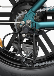 Close-up of a bicycle chain mechanism with visible brand names on a white background