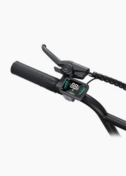 Close-up of a handlebar with a digital display and brake lever on a white background
