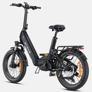 A black Zengwie folding electric bicycle with a step-through frame, rear cargo rack, front suspension fork, and disc brakes, shown on a light gray background.